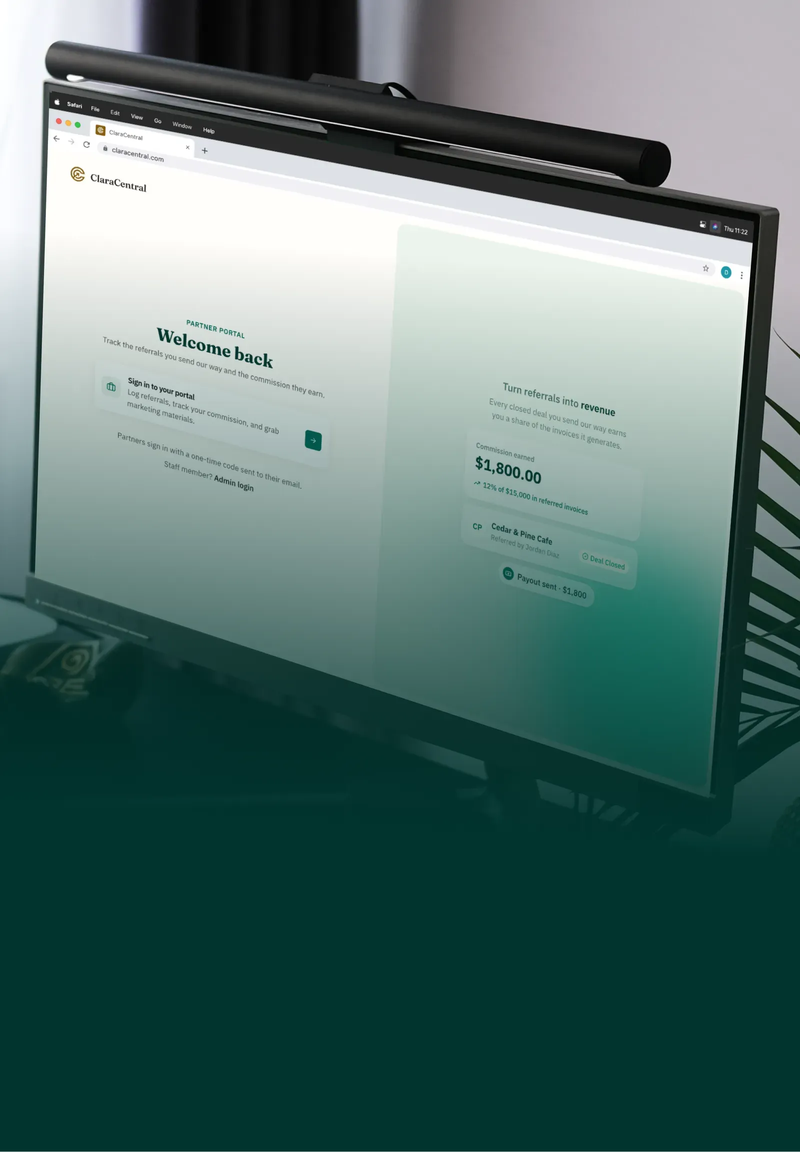 The Clara Central partner portal on a desktop monitor: a partner’s commission earned, $1,800.00 from $15,000 of referred invoices, beside a closed deal and the payout sent for it.